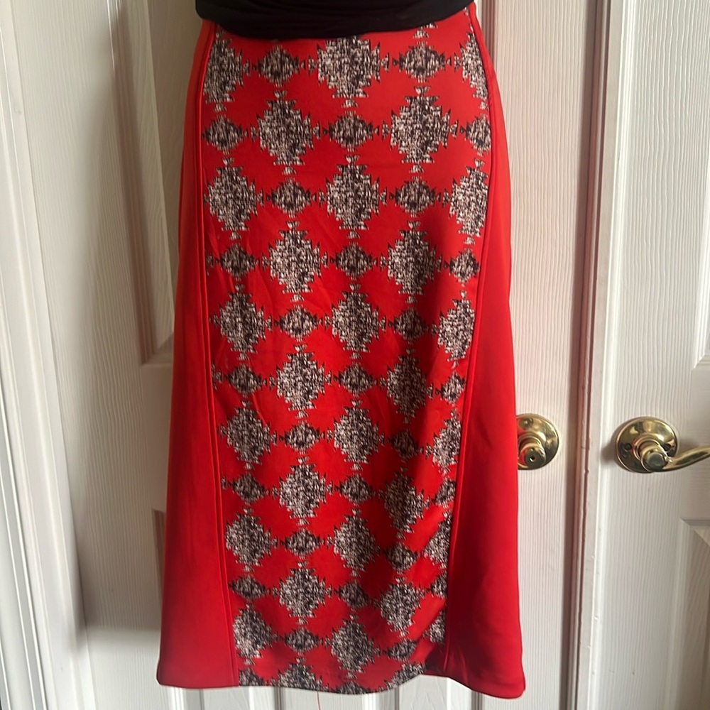 Orange, brown, & cream pencil skirt w/ back zipper. Only worn once. Stretchy.
